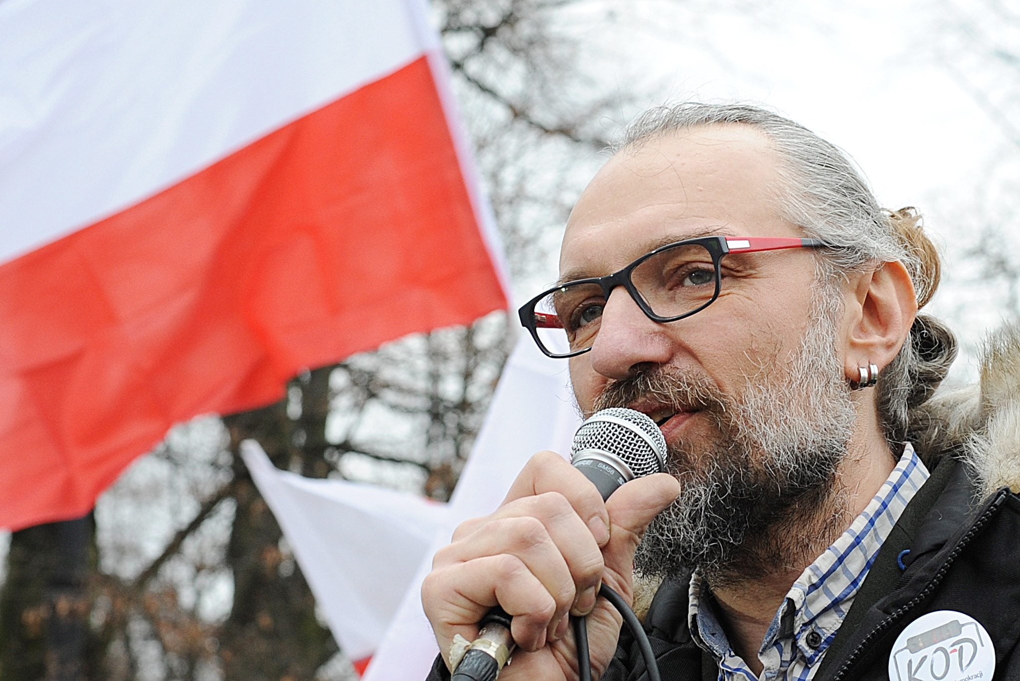 FILE - A  Dec. 19, 2015, file photo showingMateusz Kijowski, leader of the Committee for the Defense of Democracy, speaking at a demonstration in Warsaw, Poland. Kijowski?s group, which is supported by many former Solidarity activists and embraces the same values of nonviolent resistance, has organized a string of protests over the past month that have brought many thousands of people to the streets.