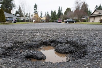 The city of Vancouver&#039;s new online app can&#039;t patch potholes like this one, at the intersection of Northeast 18th Street and Northeast 134th Avenue, but it can get a report to public works dispatchers.