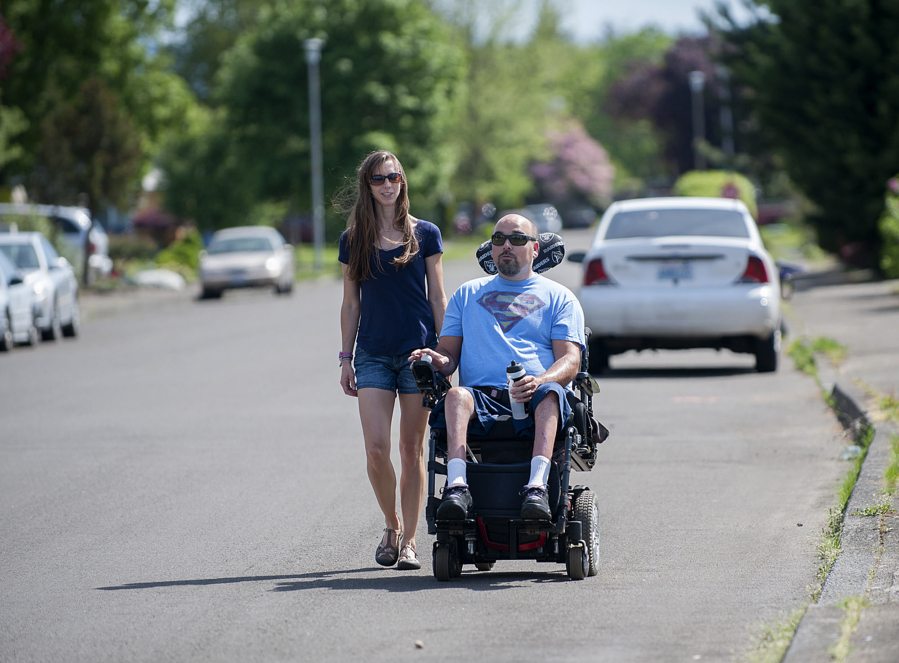 Tresa and Simonn Marsh enjoy the neighborhood together on the morning of April 18. It&#039;ll be 10 years this July since a falling tree struck Simonn Marsh while he was out fishing, leaving him paralyzed.