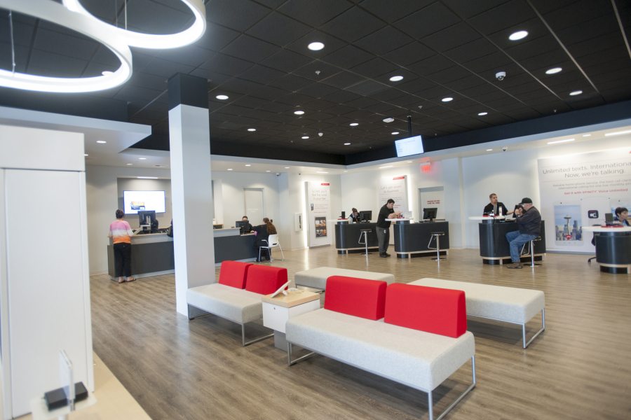 Comcast employees and customers interact in the company&#039;s new Vancouver Plaza store, which opened Monday. The Xfinity Store is part of Comcast&#039;s new approach to customer service.