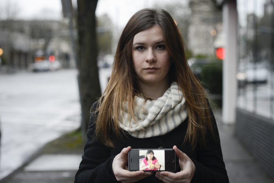 Tanya Mosh holds up a photo on her phone of her mother, Raisa Mosh, who was struck and killed, along with a friend, while in a crosswalk Jan. 19, 2014, on Northeast Vancouver Mall Drive.