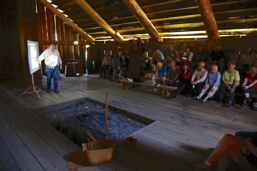 Archaeologist Ken Ames talks Sunday inside the Cathlapotle Plankhouse about what the Cathlapotle village was like before the Chinookan people made direct contact with Europeans. His lecture was part of the season opening of the plankhouse replica at the Ridgefield National Wildlife Refuge.