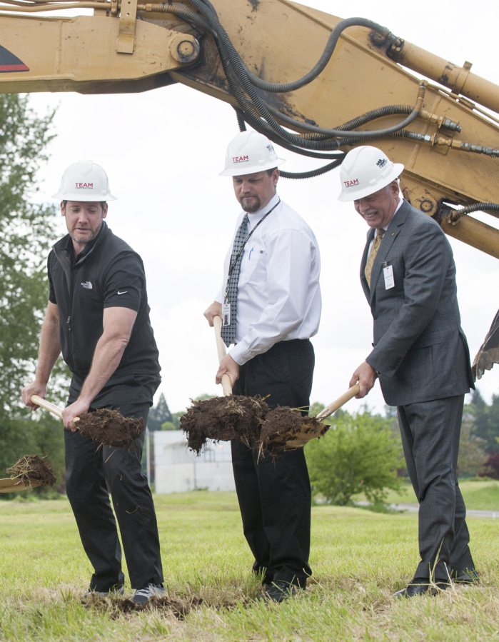 Vancouver Mayor Tim Leavitt, from left, Brad D&#039;Emilio, plant manager, and Bob Whisler, president of Kyocera International, break ground on an expansion in Vancouver on Monday.