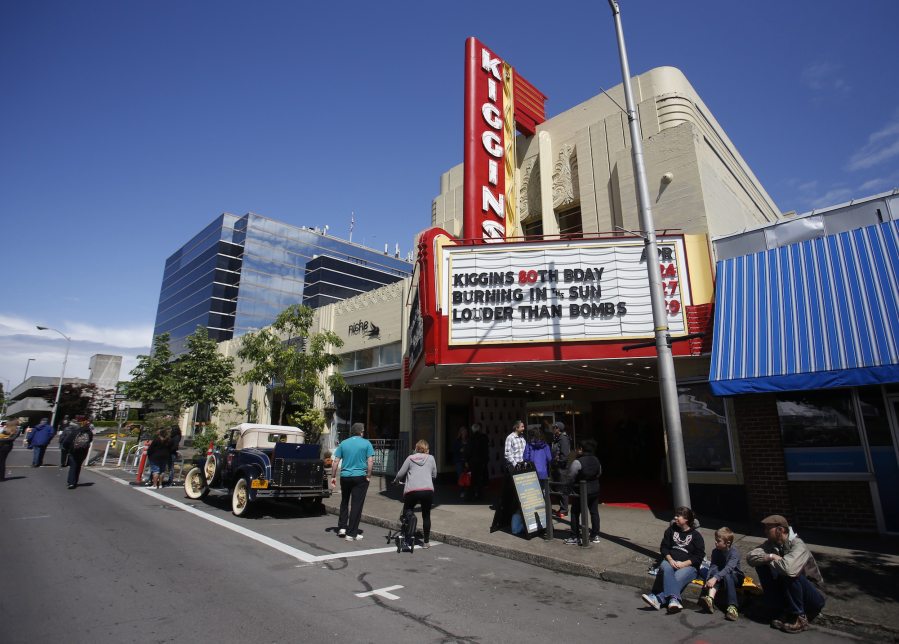 People gather outside Kiggins Theatre on Sunday as the theater celebrates its 80th birthday.