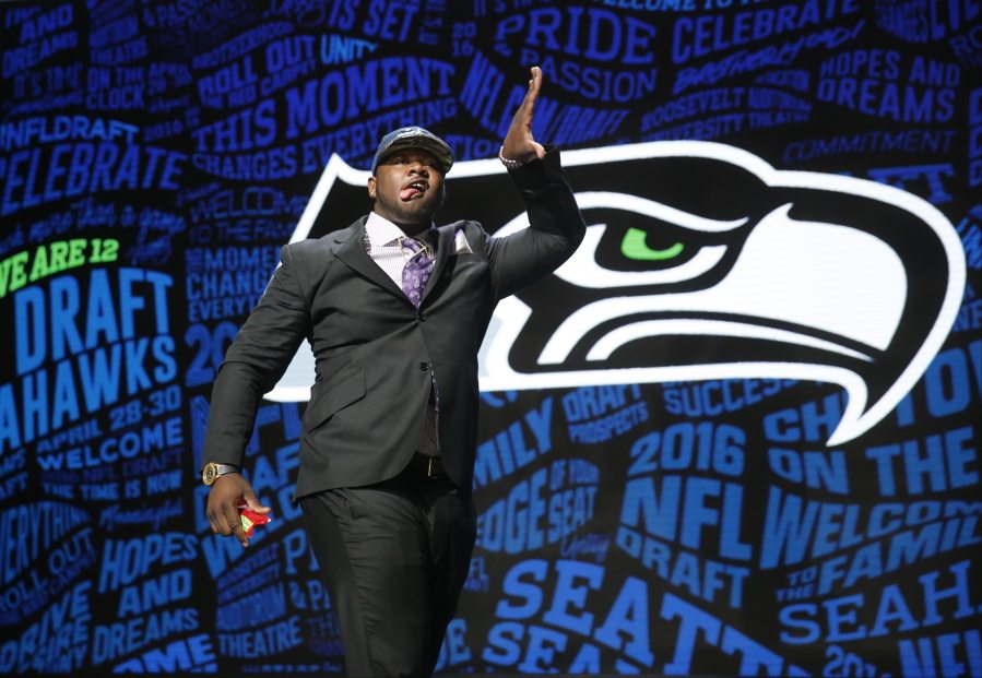 Jarran Reed celebrates after being selected by the Seattle Seahawks as the 49th pick in the second round of the 2016 NFL football draft, Friday, April 29, 2016, in Chicago.