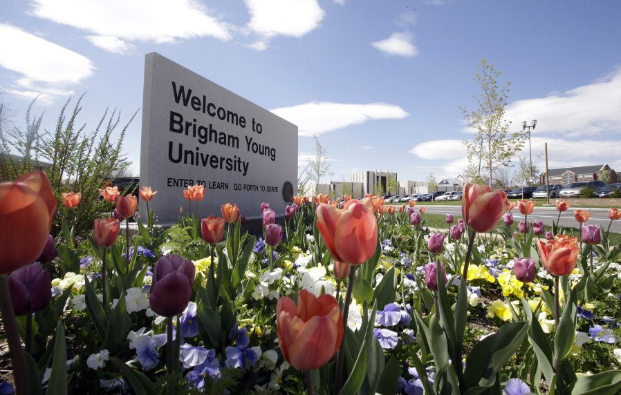 A welcome sign to Brigham Young University sits at the school in Provo, Utah. BYU students who say they were sexually assaulted are finding themselves under investigation for possible violations of the Mormon school&#039;s code against sex and drinking. BYU says it will re-evaluate the practice.
