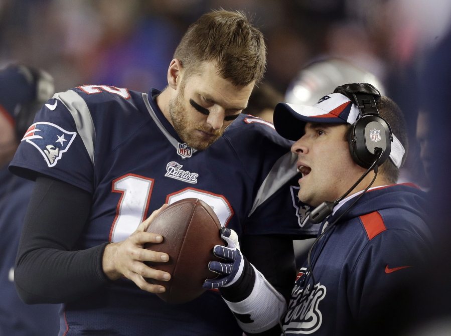New England Patriots offensive coordinator Josh McDaniels, right, talks to quarterback Tom Brady during the fourth quarter of a 2013 NFL game against the Pittsburgh Steelers in Foxborough, Mass. A federal appeals court has ruled, Monday, April 25, 2016,  that New England Patriots Tom Brady must serve a four-game "Deflategate" suspension imposed by the NFL, overturning a lower judge and siding with the league in a battle with the players union.