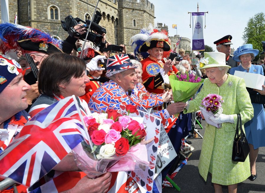 Britain&#039;s Queen Elizabeth II meets well wishers Thursday during a walkabout close to Windsor Castle in Berkshire, England, as she celebrates her 90th birthday.