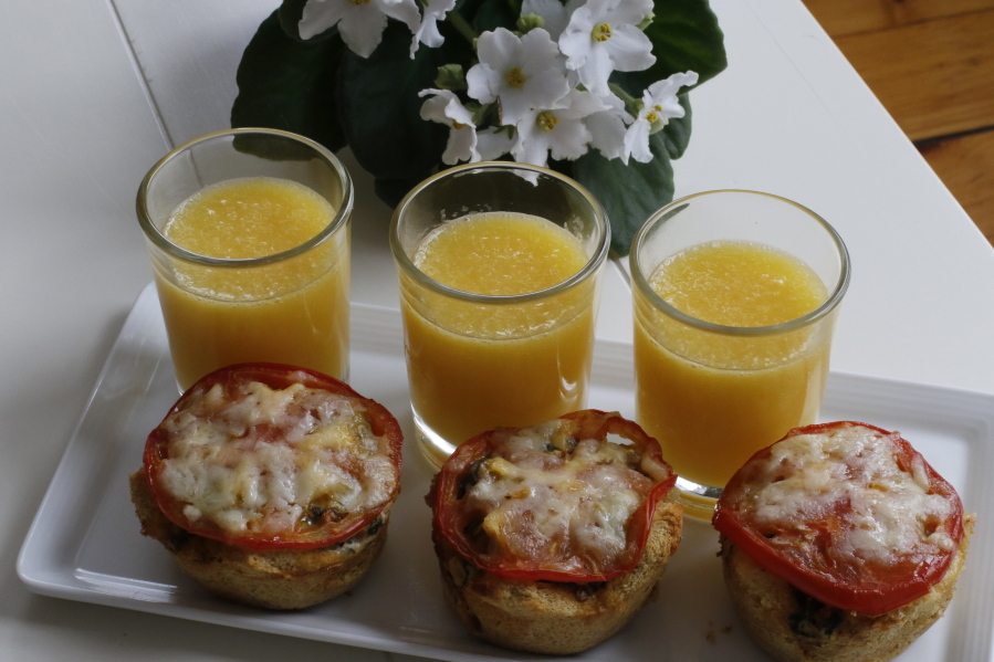 This April 4, 2016 photo shows easy overnight individual egg strata in Concord, N.H. These savory egg, meat and vegetable treats are ideal for a Mother?s Day breakfast in bed because they are easy to eat and can be prepped the night before. (AP Photo/J.M.
