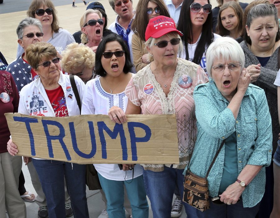 A group of women shout their support as they wait to attend a Republican presidential candidate,Donald Trump campaign rally Monday in Wilkes-Barre, Pa.
