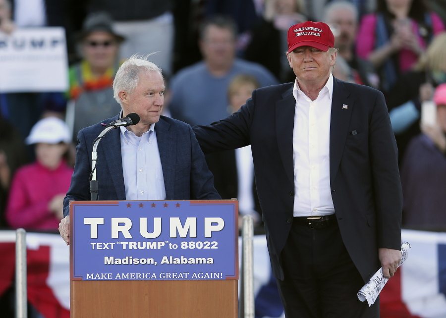 Republican presidential candidate Donald Trump, right, stands next to Sen. Jeff Sessions, R-Ala., as Sessions speaks during a rally in Madison, Ala. Trump and Sessions are an unlikely pair: a brash New York businessman and a courtly Alabama senator. But Sessions, the only senator to so far endorse the Republican front-runner, has found a kindred spirit in Trump, who shares his hard-line views on immigration and vigorous opposition to free trade agreements.