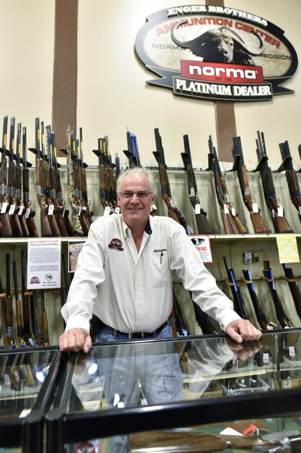 Jay Wallace, founder of Adventure Outdoors, poses for a portrait, in Smyrna, Ga. Wallace was among a group of gun dealers once sued by then-New York Mayor Michael Bloomberg over allegations of allowing illegal sales of firearms.