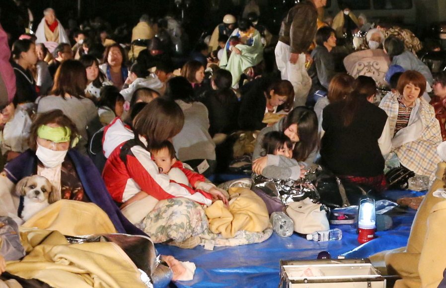 Residents take shelter at the town hall of Mashiki, in Kumamoto, southern Japan, after the earthquake early Friday.  A powerful earthquake with a magnitude of 6.5 knocked over buildings in southern Japan on Thursday evening, and police said people may be trapped underneath.
