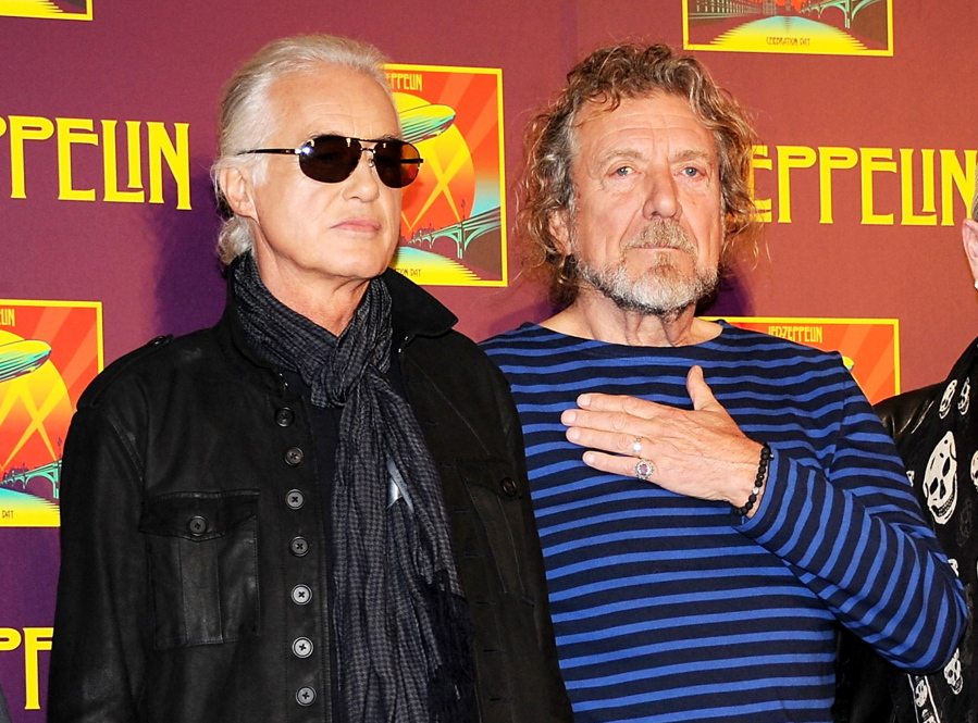 FILE - In this Oct. 9, 2012 file photo, members of Led Zeppelin, guitarist Jimmy Page, left, and singer Robert Plant appear at a press conference ahead of the worldwide theatrical release of &quot;Celebration Day&quot;, a concert film of their 2007 London O2 arena reunion show, in New York. A federal judge in Los Angeles ruled Friday, April 8, 2016, that a copyright infringement lawsuit over the Led Zeppelin song &quot;Stairway to Heaven&quot; should be decided at trial. A trustee of late songwriter-guitarist Randy Wolfe sued the band claiming &quot;Stairway to Heaven&quot; copies the opening notes of a song created by Wolfe in the late 1960s.