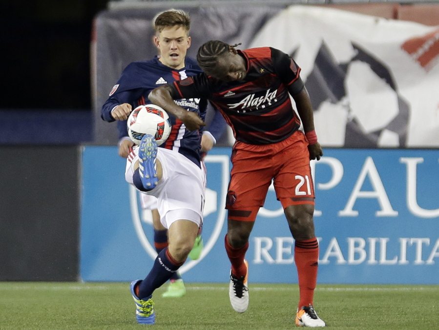 New England Revolution&#039;s Kelyn Rowe, left, and Portland Timbers&#039; Diego Chara, right, vie for control of the ball during the second half of an MLS soccer game Wednesday, April 27, 2016, in Foxborough, Mass.