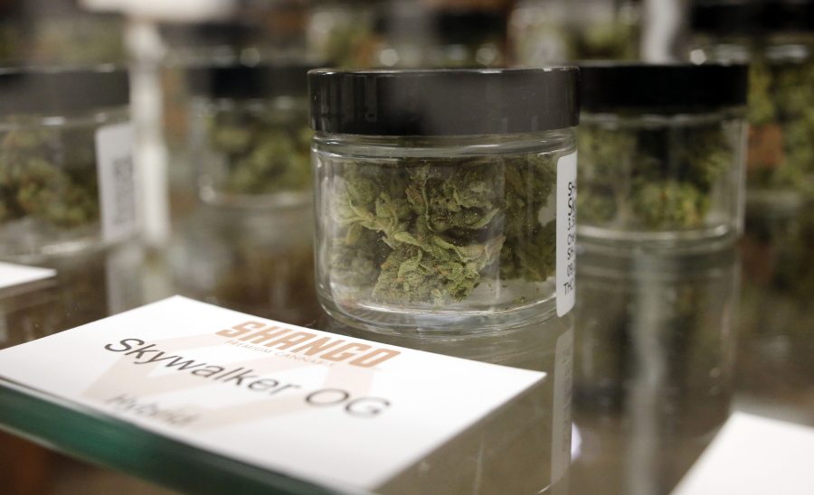 FILE - In this Sept. 30, 2015, file photo, Cannabis is packaged and ready for sale in Shango Premium Cannabis, in Portland, Ore. As more states legalize marijuana banking remains a major hurtle for the industry. The federal government could decide this summer to reclassify marijuana from the &quot;most dangerous drugs&quot; list, although it&#039;s unclear how the banking industry will respond. (AP Photo/Timothy J.