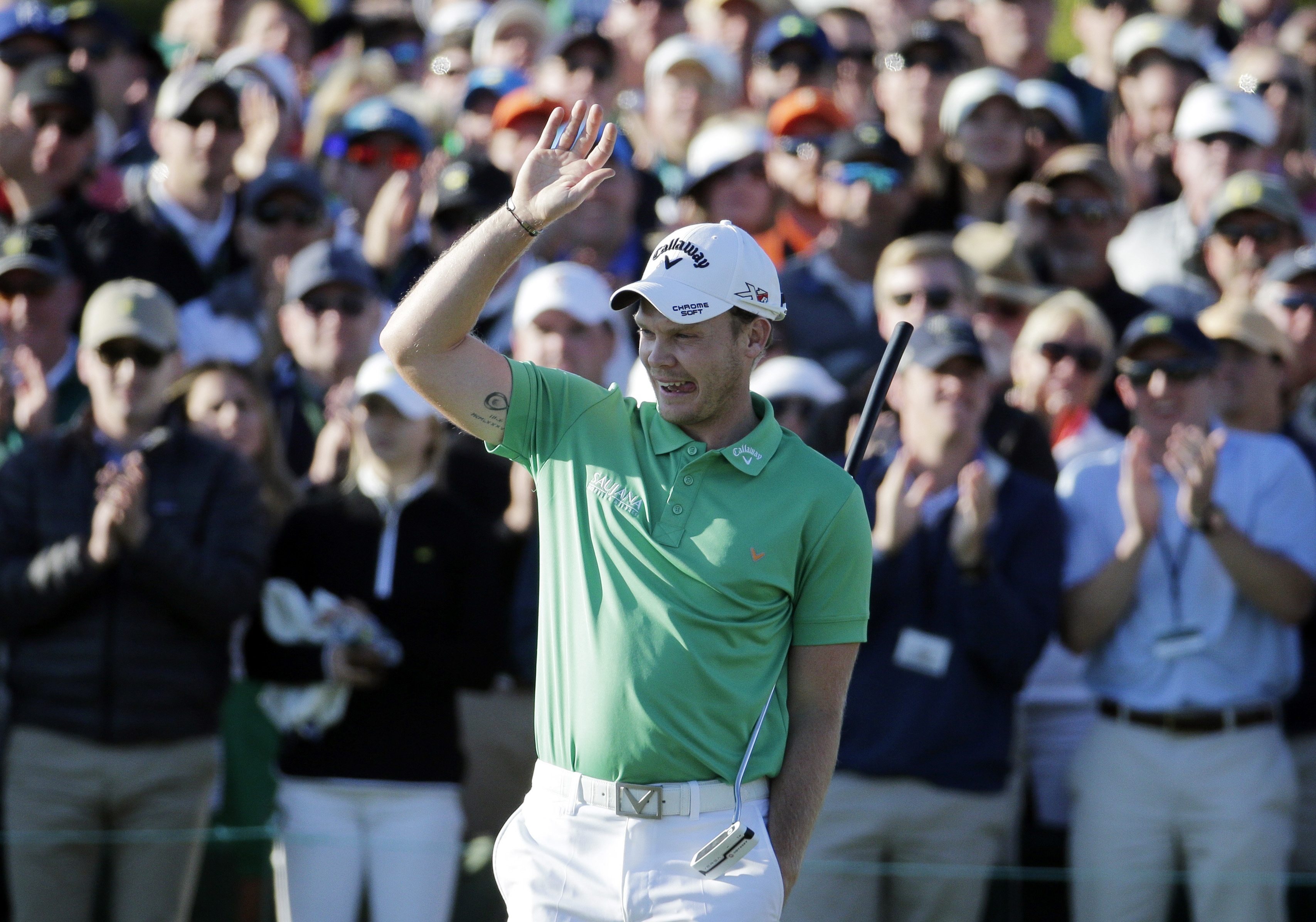 Danny Willett, of England, celebrates on the 18th hole after finishing the final round of the Masters golf tournament Sunday, April 10, 2016, in Augusta, Ga.