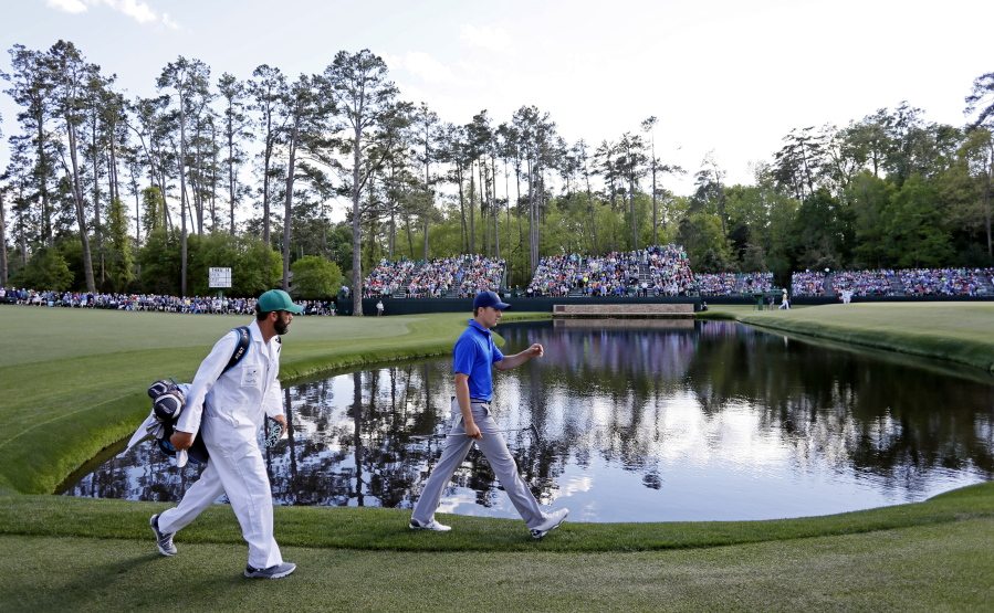 Jordan Spieth walks along the 15th fairway during the second round of the Masters golf tournament Friday, April 8, 2016, in Augusta, Ga.