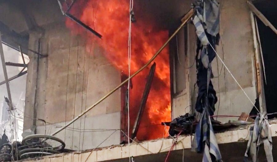 This image made from video and posted online from Validated UGC shows a building on fire after airstrikes hit Aleppo, Syria on Thursday. A Syrian monitoring group and a first-responders team say new airstrikes on the rebel-held part of the contested city of Aleppo have killed over a dozen people and brought down at least one residential building. The new violence on Thursday brings the death toll in the past 24 hours in the deeply divided city to at least 61 killed.