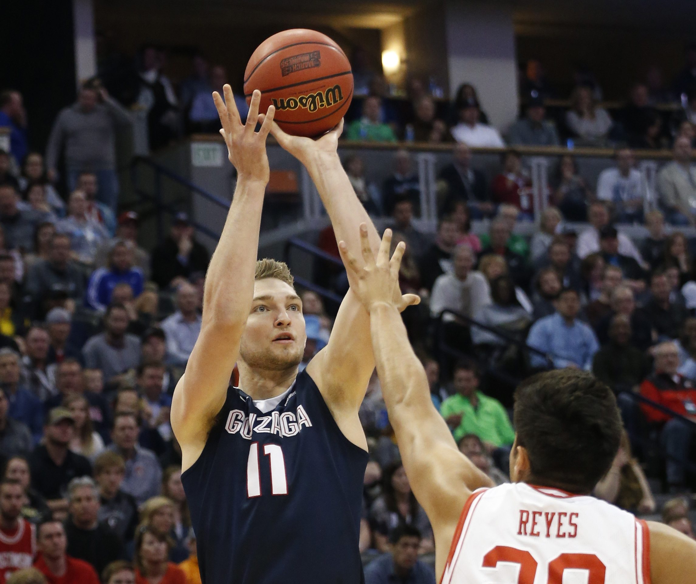 Gonzaga forward Domantas Sabonis shoots over Utah forward Chris Reyes during the first half of a second-round men's college basketball game Saturday, March 19, 2016, in the NCAA Tournament in Denver.