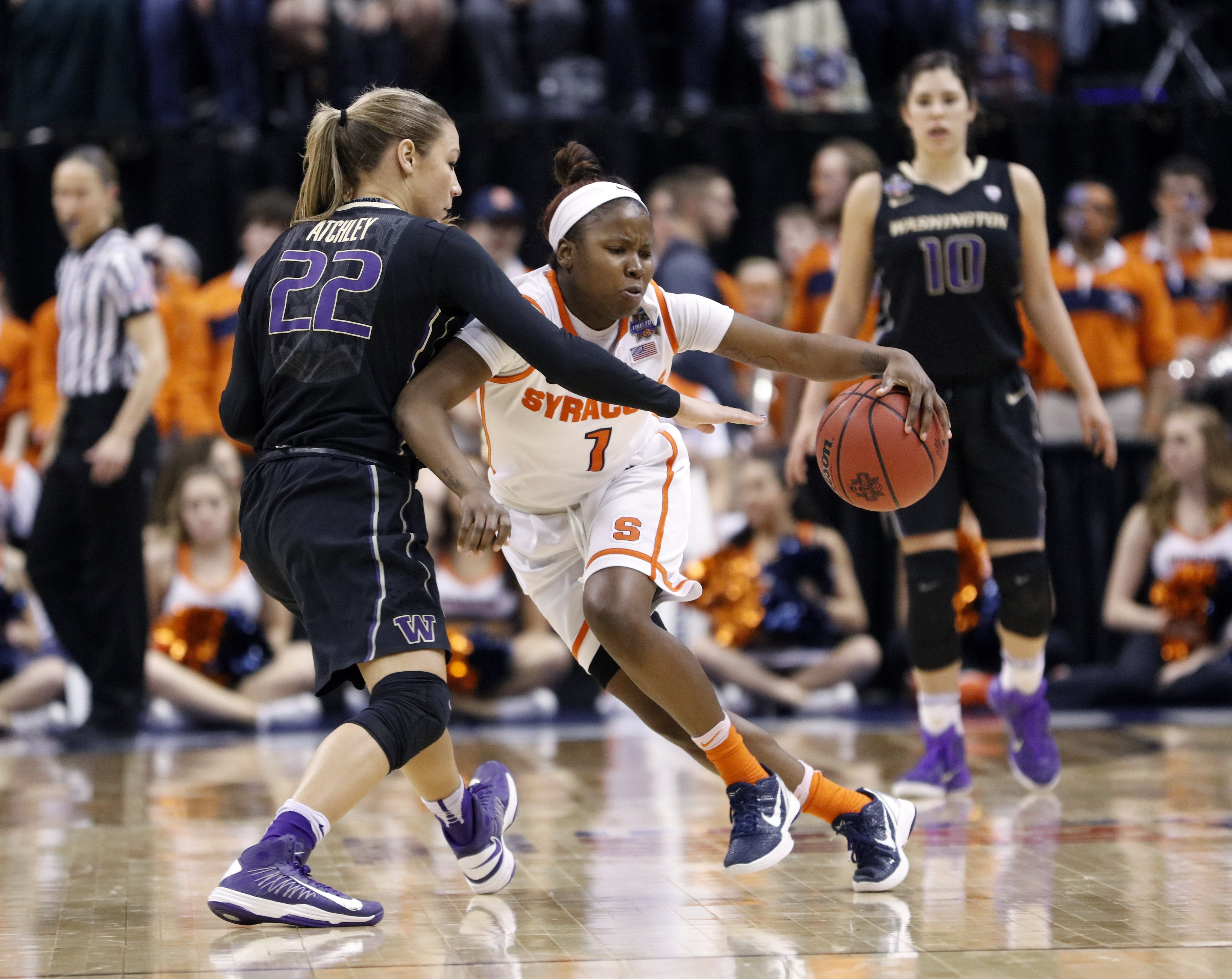 Syracuse's Alexis Peterson (1) is defended by Washington's Alexus Atchley (22) during the second half of a national semifinal game at the women's Final Four in the NCAA college basketball tournament Sunday, April 3, 2016, in Indianapolis. Syracuse won 80-59.