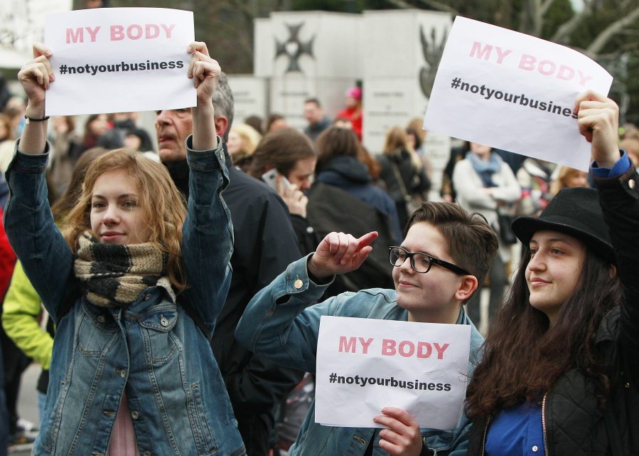 Women holding slogans take part in a street protest against further tightening of Poland?s already strict anti-abortion law in Warsaw, Poland, on Saturday, April 9, 2016. Similar protests were also organized in other cities by a new pro-abortion group that opposes steps by some of Poland?s Catholic bishops and an anti-abortion organization to introduce an unconditional ban on abortion in Poland.
