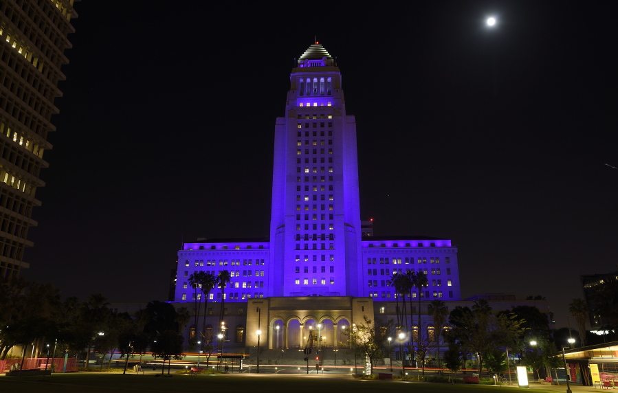 Los Angeles city hall is lit up in purple as a tribute to the late pop musician Prince, Saturday, April 23, 2016, in Los Angeles. Prince passed away at his home in suburban Minneapolis at age 57 on Thursday. (AP Photo/Mark J.