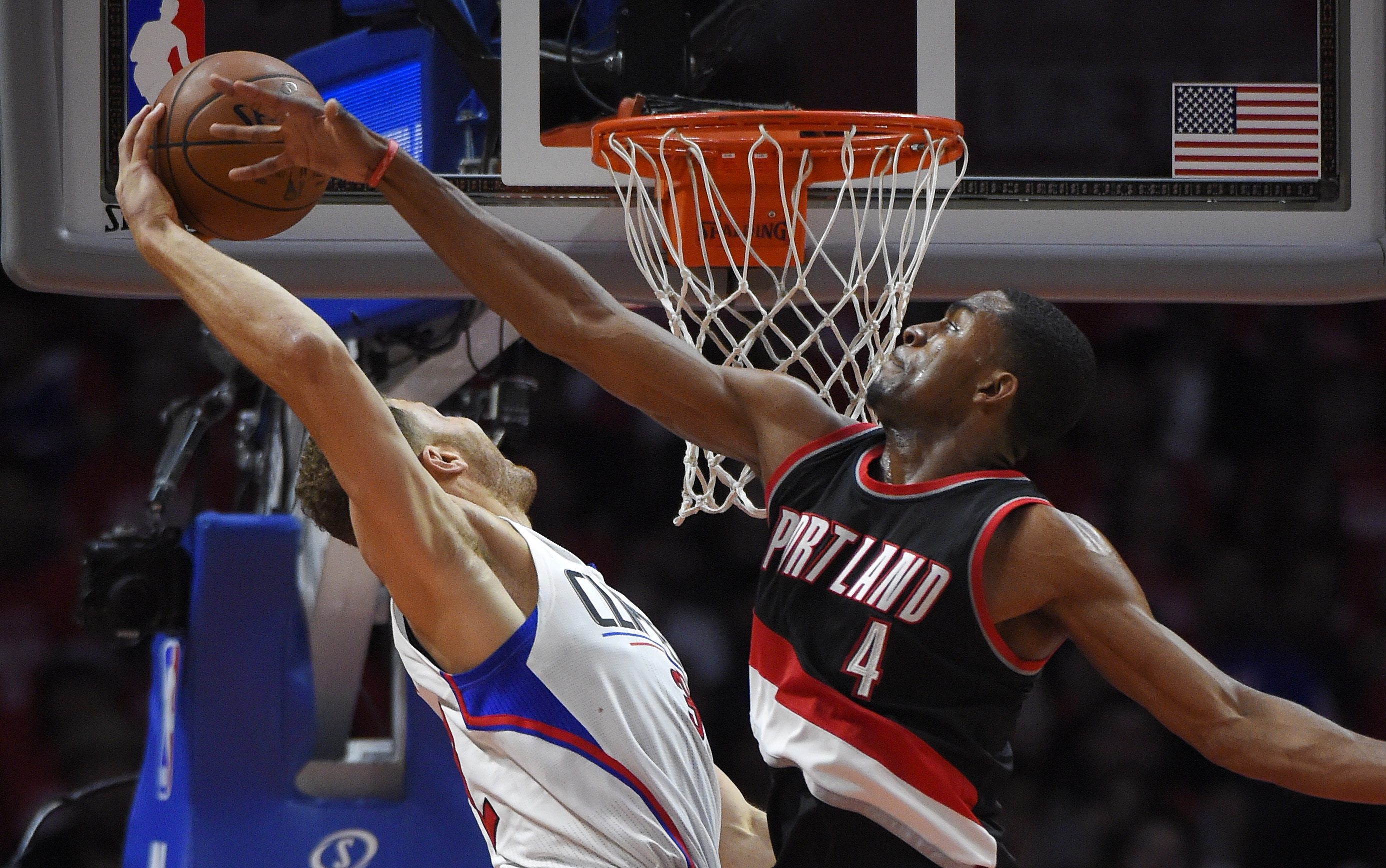 Los Angeles Clippers forward Blake Griffin, left, goes up for a dunk as Portland Trail Blazers forward Maurice Harkless defends during the second half in Game 2 of a first-round NBA basketball playoff series, Wednesday, April 20, 2016, in Los Angeles. The Clippers won 102-81. (AP Photo/Mark J.