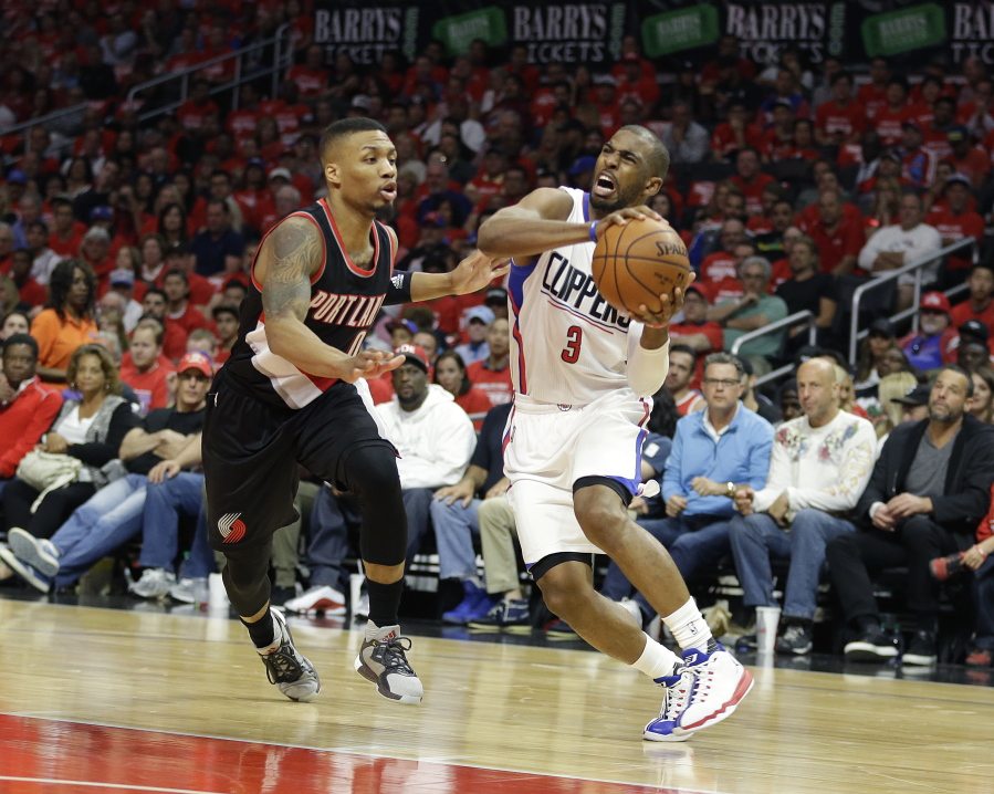 Los Angeles Clippers&#039; Chris Paul, right, is pressured by Portland Trail Blazers&#039; Damian Lillard in the first half in Game 1 of their series. Game 2 is tonight in Los Angeles. (Jae C.