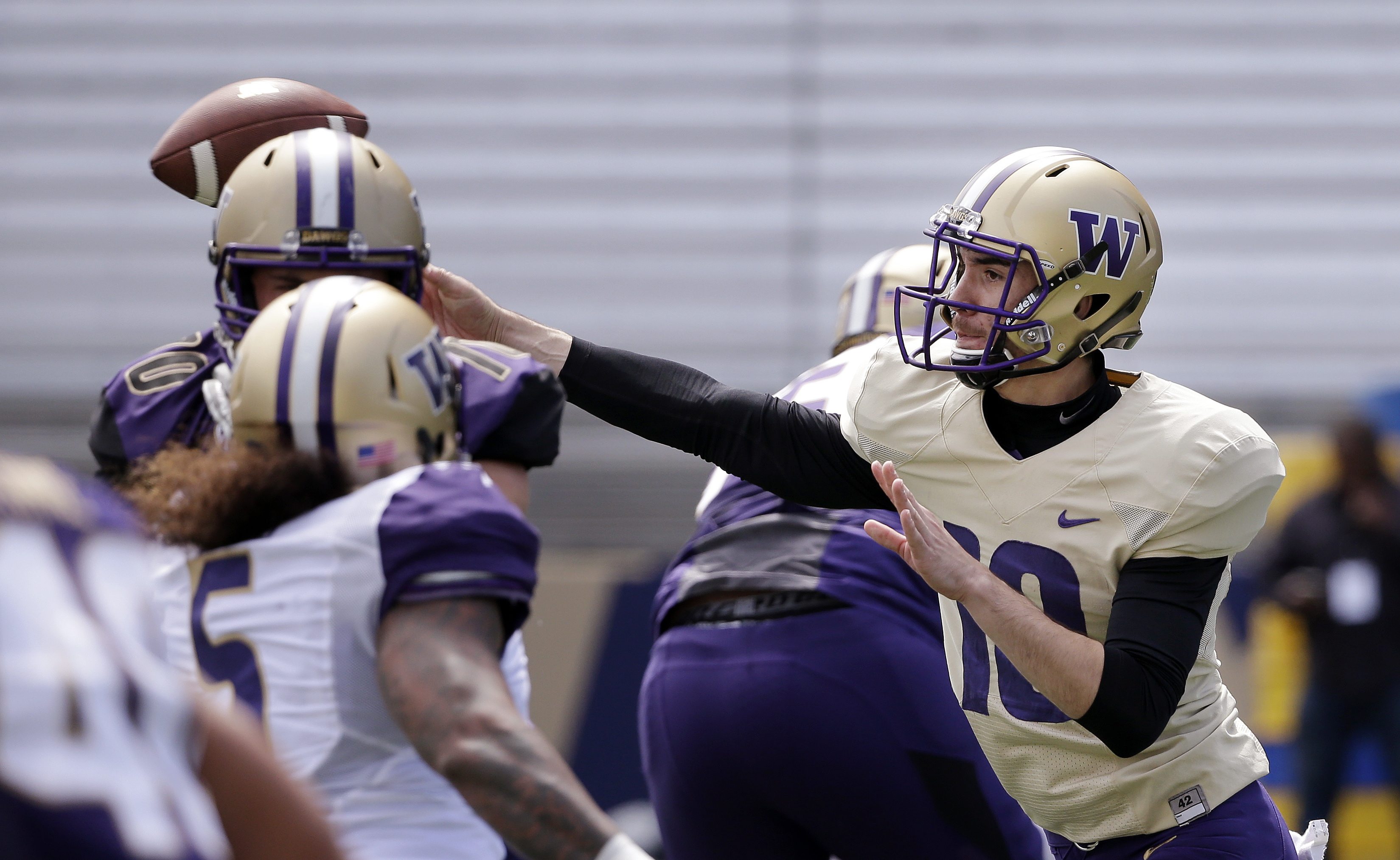 Washington quarterback Tony Rodriguez throws at the team's annual spring preview college football event Saturday, April 23, 2016, in Seattle.