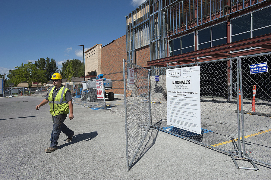 Adam Kozera of C&amp;E Rentals walks through the construction site Monday of a new Marshall&#039;s store at Hazel Dell Marketplace. The project benefited from Clark County&#039;s fee waiver program, which eliminates fees for all non-residential projects in unincorporated areas.
