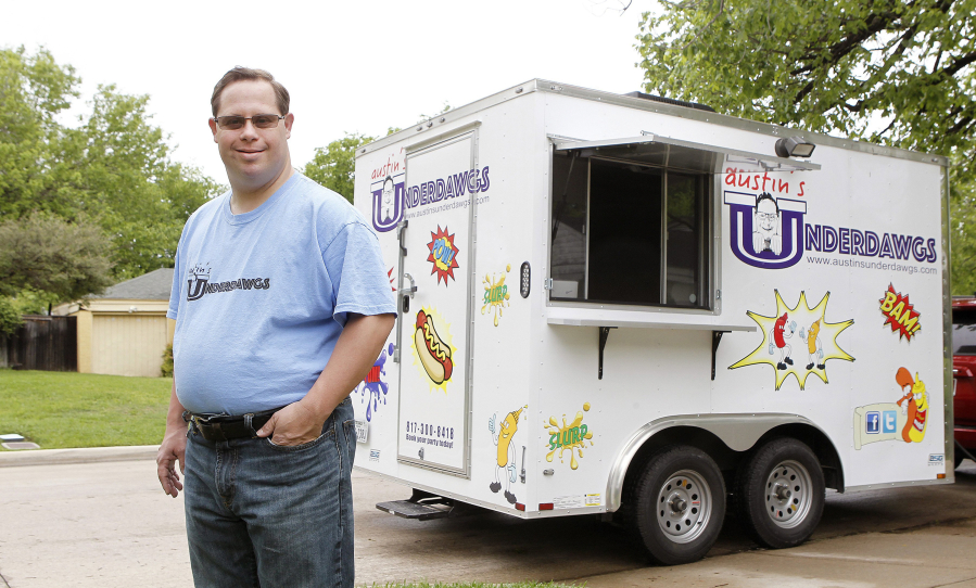 Austin Underwood serves specialty hot dogs at his Austin&#039;s Underdogs food truck in Fort Worth, Texas.