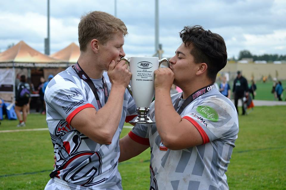 Rees Alferd, left, and Hayden Ramsay celebrate winning the Rugby Oregon Varsity Premiership title on Saturday, May 21, 2016 at Portland's Delta Park.