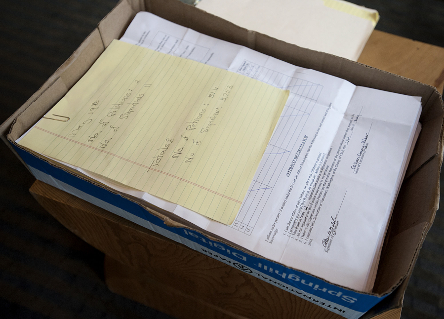 A box of signed petitions is seen May 1 at Vancouver City Hall.