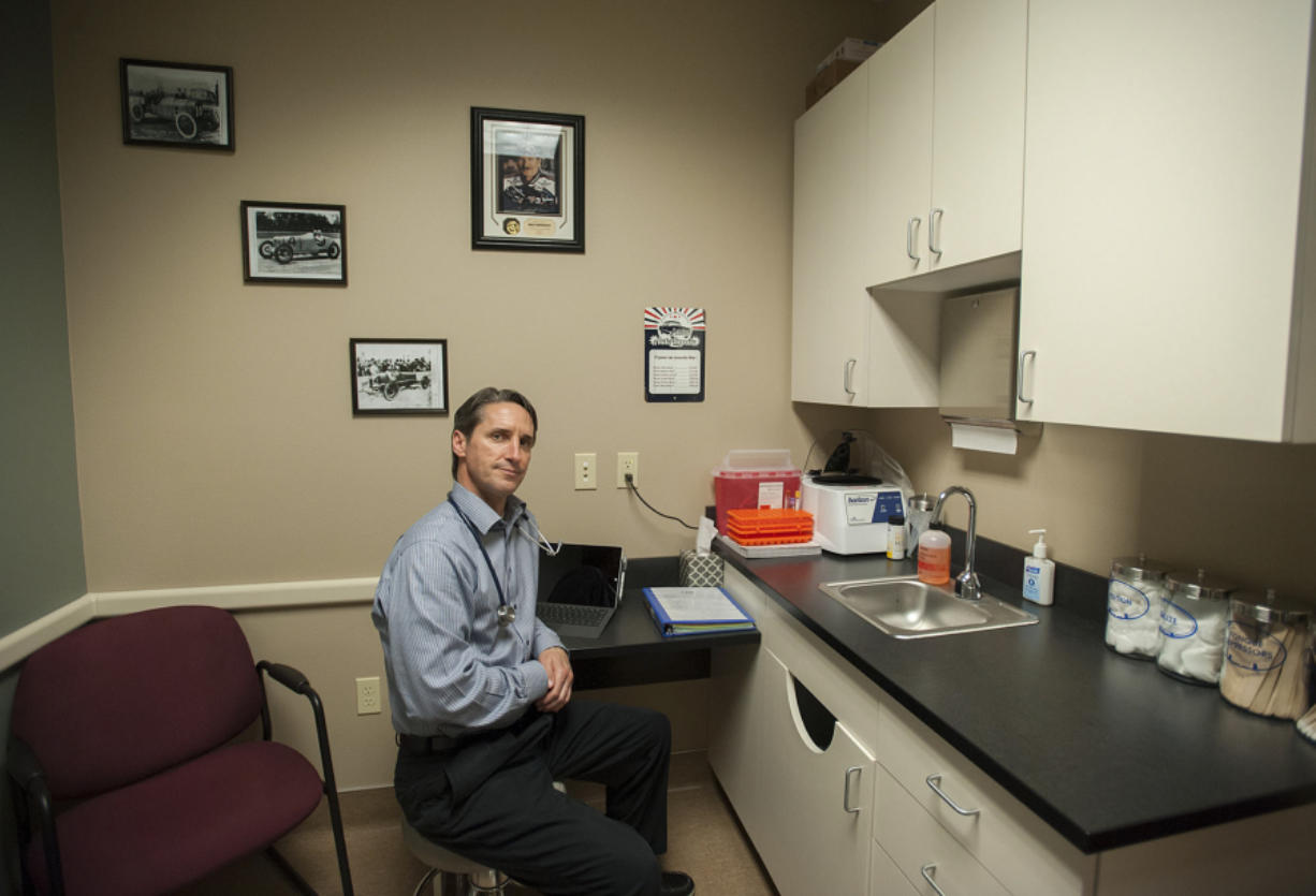 Dave McQuivey sits in one of the exam rooms Wednesday afternoon at Man Alive Clinic at 9430 N.E. Vancouver Mall Drive.