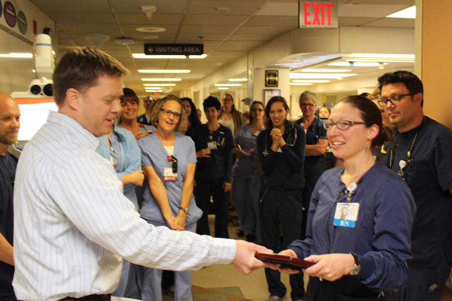 North Garrison Heights: PeaceHealth Southwest Medical Center nurse Amy Ciecko, right, receiving the David Lloyd Exceptional Nurse Award.