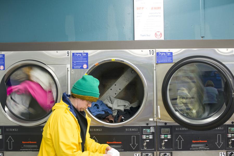 Ada, who didn&#039;t give her last name, loads up a dryer at the Laundry Love laundromat in Vancouver on April 28.