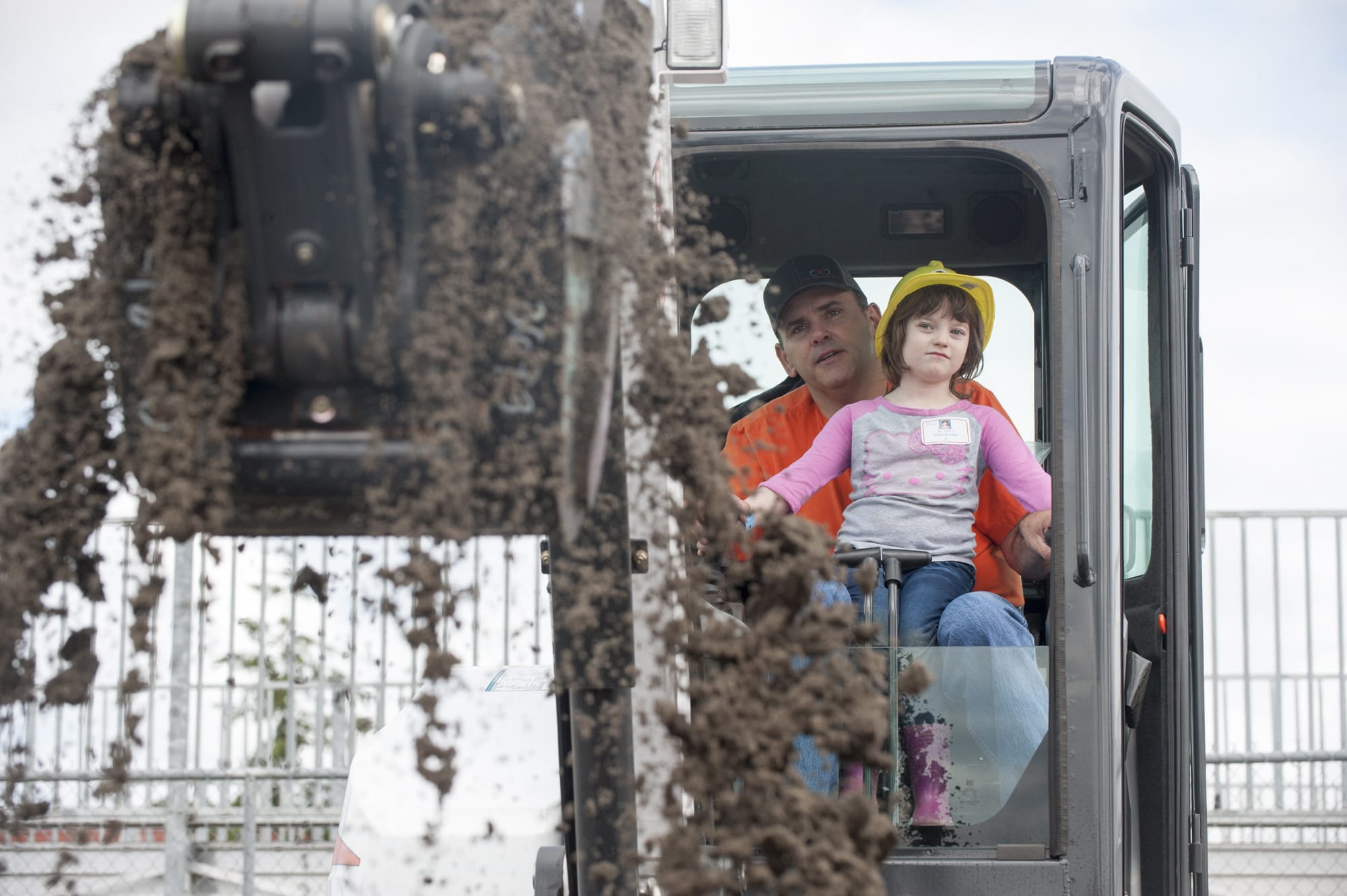 Burton Elementary school student Ashley Keniston 5, gets a turn to operate an earth moving machine at the preview day for Dozer Days at the Clark County Fairgrounds in Ridgefield Friday May 20, 2016. Students from Evergreen public schools got a chance to participate in the Dozer Days Event.