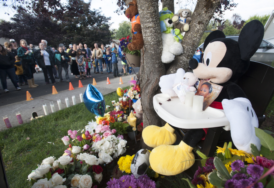 Friends, neighbors and other community members attend a vigil Friday evening in Battle Ground for Jose &quot;Pepe&quot; Castillo-Cisneros, who was killed earlier this week. Pepe, who had autism, loved Mickey Mouse.