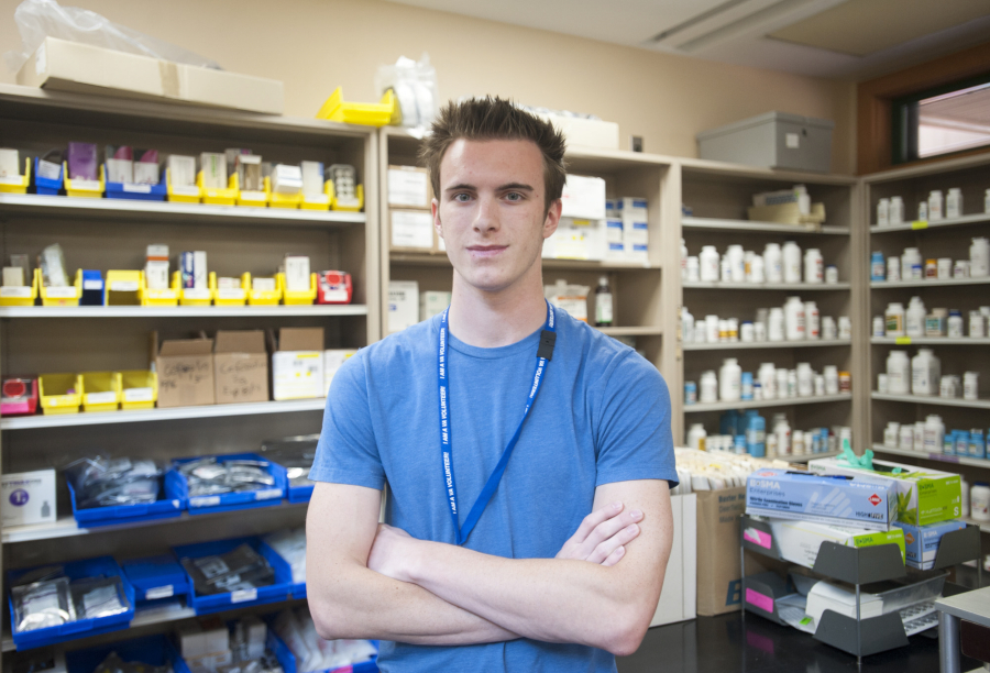 Andrew Lee, 18, senior at Henrietta Lacks Health and Bioscience High School, interns in the pharmacy at the Vancouver Veterans Affairs campus. HeLa High is graduating its first class of seniors, and many are doing health internships in the community.