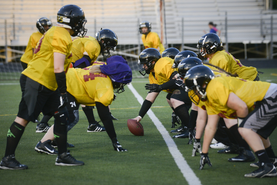 Members of the Portland Fighting Shockwave, a women's full-contact football team, practice at Milwaukie High School on Friday, May 6, 2016.