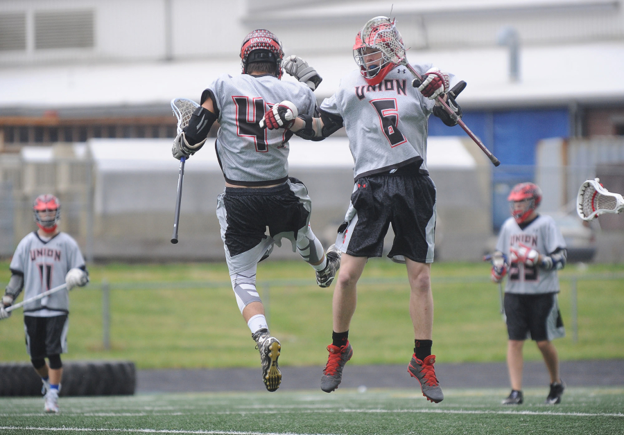 Union&#039;s Jon Stell, left, and Nathan Lindquist react after a goal was scored in a state semifinal lacrosse match against Gonzaga Prep at Camas High School on Wednesday.