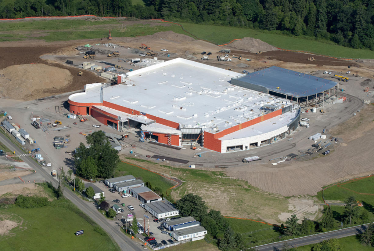 As seen in this aerial photo taken Friday morning, construction on the new Cowlitz casino along Interstate 5 at Exit 16 is about 40 percent complete, according to the Cowlitz Tribe. Clark County health officials are recommending the casino hook up to the city of La Center&#039;s sewer system out of public health necessity.
