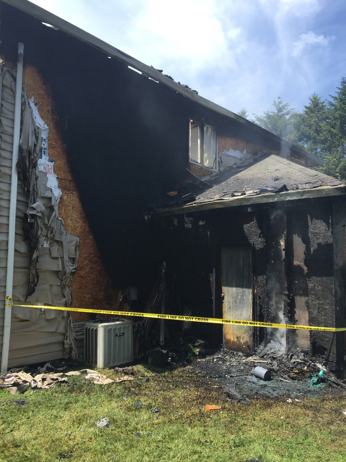 The fire started at the back of the home and moved into the attic, causing extensive damage.