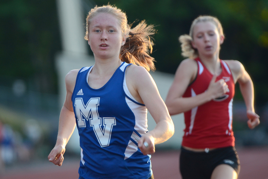 Savanna Craig, a junior at Mountain View, leads Ellie Postma, a Camas sophomore, in a 800 meter heat during the first day of the Greater St. Helens 4A district championship track meet at McKenzie Stadium in Vancouver on Wednesday, May 11, 2016. The meet continues on Friday.