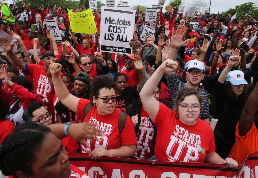 Protesters converge at the McDonald&#039;s campus Thursday in Oak Brook, Ill., to rally for a $15 per hour work wage during the annual shareholders meeting.