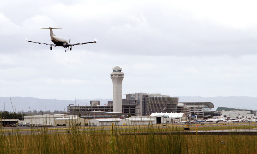 A plane lands at Portland International Airport in 2014. Portland had a record four perimeter fence breaches in 2015.