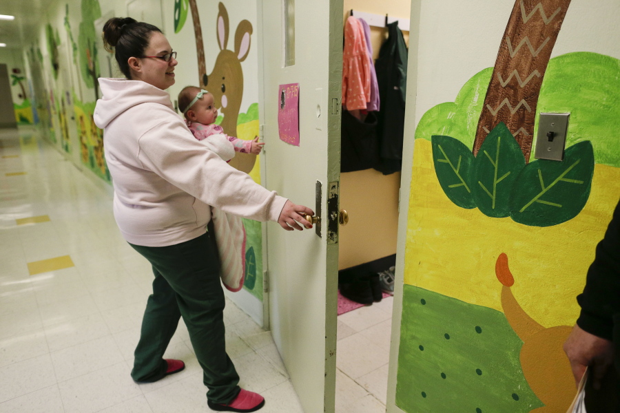 Holding her daughter, Codylynn, Jennifer Dumas opens the door to her room inside the nursery at the Bedford Hills Correctional Facility in Bedford Hills, N.Y. Bedford Hills has one of only eight working prison nurseries where women live with their babies, out of more than 100 women&#039;s prisons around the country.