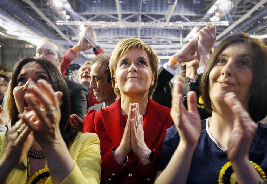 Scottish National Party leader Nicola Sturgeon reacts Friday as results come in at a Scottish Parliament election count in Glasgow, Scotland. Voters punished the opposition Labour Party in Scotland as the first results rolled for local and regional elections across the United Kingdom.