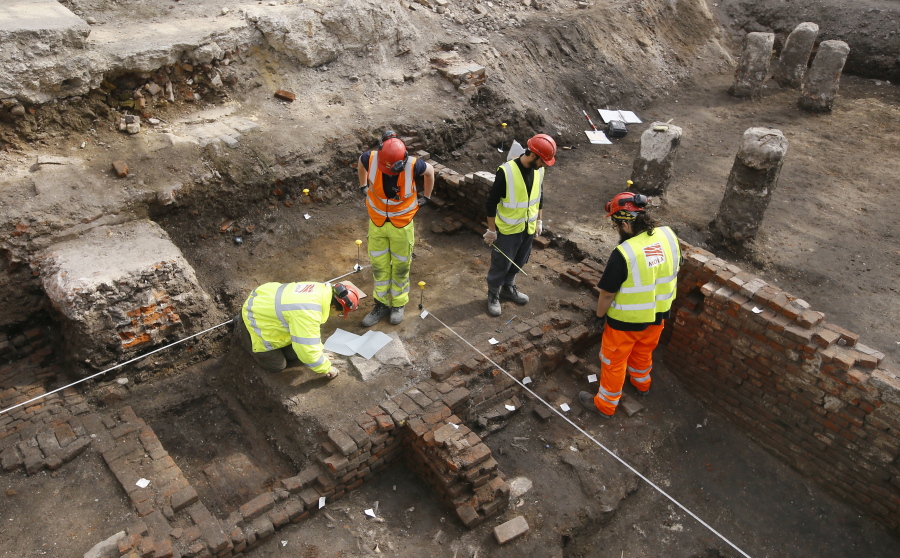 Archaeologists work on the exposed remains as the site of Shakespeare&#039;s Curtain Theatre is excavated in Shoreditch in London, Tuesday, May 17, 2016.  Archaeologists are excavating the remains of the Curtain, a 16th-century theater where some of the Bard&#039;s play&#039;s were staged, before another gleaming tower joins the city&#039;s crowded skyline.
